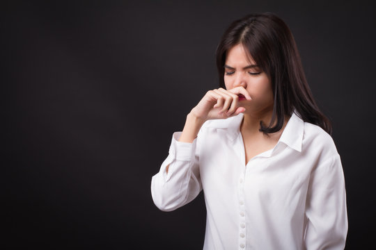 woman catching a cold, runny nose