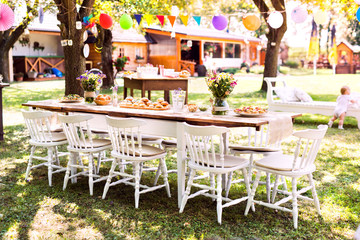 Table set for a garden party or celebration outside.