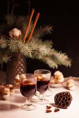 glasses for mulled wine, Hot Holiday mulled wine, winter hot drink, warming, New Year's background, mulled wine against a background of dried flowers, cotton, spruce branches