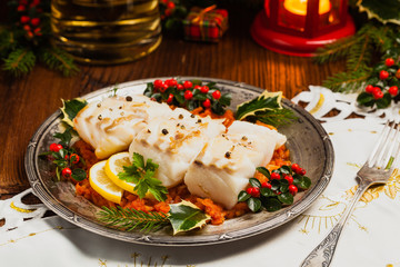 Christmas fish. Roasted cod pieces, served in vegetable sauce.