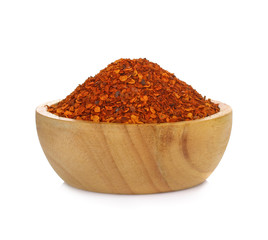  Chilli Powder in wooden bowl isolated on white background
