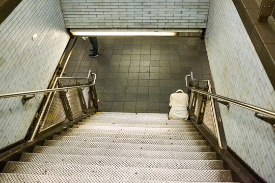 Homeless Person Sleeping In A Subway Station In New York