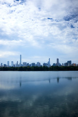 Fototapeta na wymiar New York skyline and reflection on Jackie Onassis reservoir in Central Park, Manhattan, New York