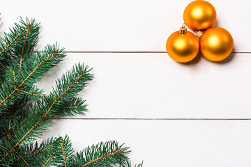 Christmas composition. pine cones, fir branches on wooden white background. Flat lay, top view