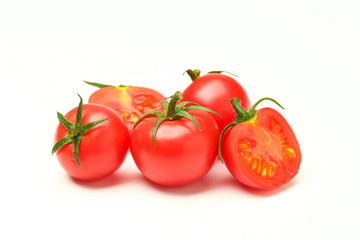 small tomatoes isolated on white background