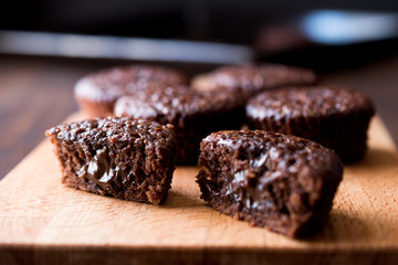 Mini Chocolate Cake Souffle on wooden surface.