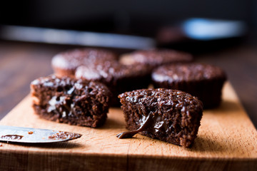 Mini Chocolate Cake Souffle on wooden surface.