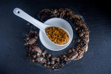 Spices on a table with mustard