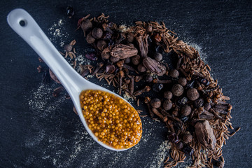 Spices on a table with mustard