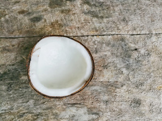 Coconut on wooden background.