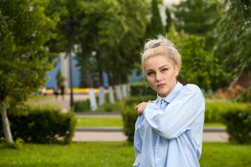 Charming young blonde posing on nature