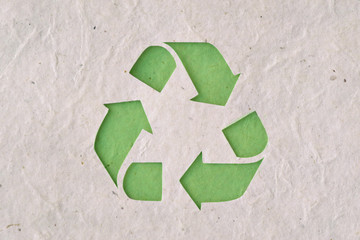 Recyclig symbol on recycled paper