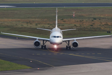 passenger airplane on an airport taxiway
