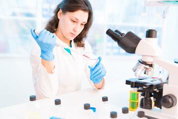 Young female technician in the laboratory of food quality control