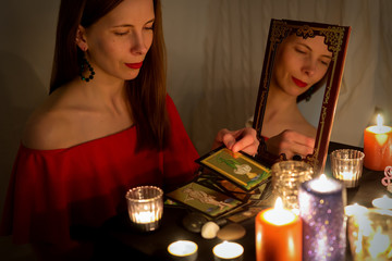 woman guessing on tarot cards