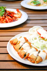 pie and salad served with sour cream sauce