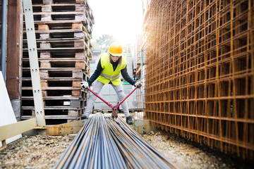 Young woman worker with large bolt cutters.