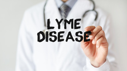 Doctor writing word Lyme Disease with marker, Medical concept