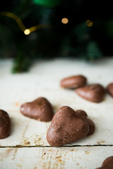 Gingerbread covered in chocolate on Christmas tree background