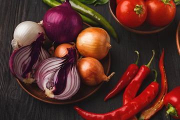 Onion and chilli on wooden background