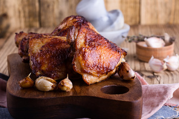Roast chicken thighs on cutting board