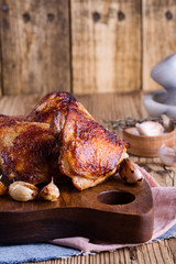 Roast chicken thighs on cutting board