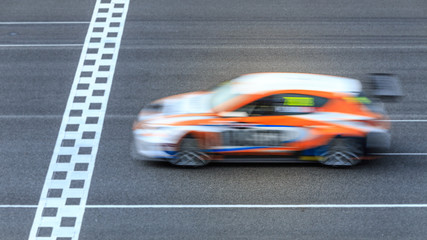 Motion Blur race car racing on speed track, Super car race on the international race track crossing...