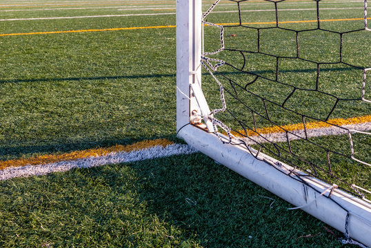 Abstract image of soccer goalpost. Image of corner of goal post. Outdoor sports stadium and field markers.