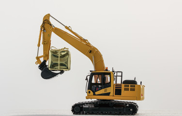 Christmas gift  with  Excavator  model ,  Holiday celebration concept new year on white background