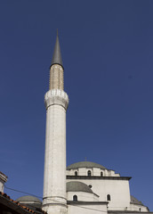 Fototapeta na wymiar Looking up on the majestic architecture of Gazi Husrev beg mosque and its minaret in Sarajevo