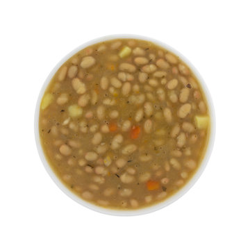 Top view of a bowl filled with bean and carrot soup isolated on a white background.