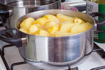 Potatoes cooked in a pot on the gas stove