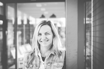 modern young business woman in casual look in front of glass building