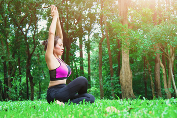 Yoga woman - relax in the park.
