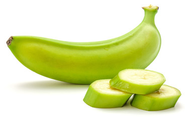 One whole plantain and three slices isolated on white background.
