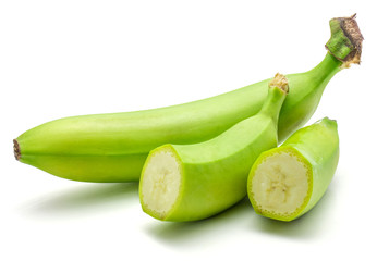 One whole and two halves of plantain isolated on white background green banana.