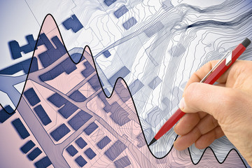Imaginary cadastral map of territory with buildings, roads and hand drawing a chart fluctuation about the housing market