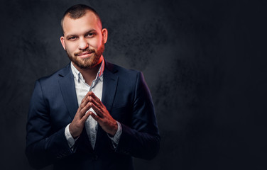 A man dressed in an elegant blue evening suit.