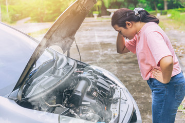 asian women worry and stress a trouble with car engine crash overheat