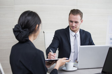 Young Business people working together with serious emotion. Business people takling in modern office. business people working concept