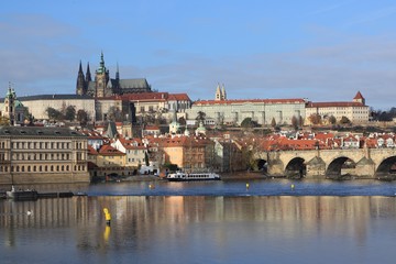 Obraz premium picturesque Prague Castle with the famous Charles bridge and the Vltava river, Czech Republic 