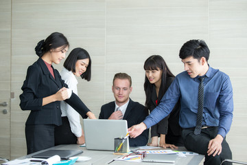 Young Business people working together with happy emotion when finish online meeting. Business people takling in modern office. business team success concept