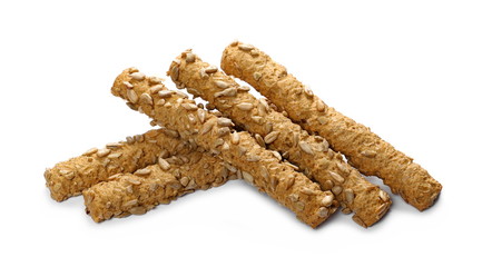 Integral bread sticks with sunflower seeds isolated on white background