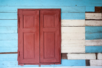Old wood window on wooden wall