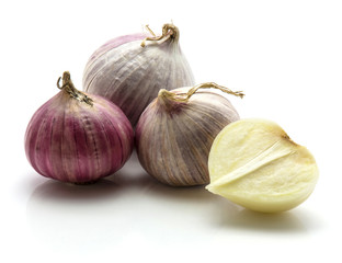 Fototapeta premium Solo garlic isolated on white background three whole bulbs and one half.