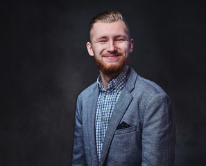 Fototapeta premium A man dressed in a suit over grey background.