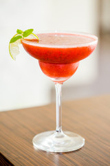 Strawberry Cocktail Margarita with Lime and Mint Leaves, Vertical View