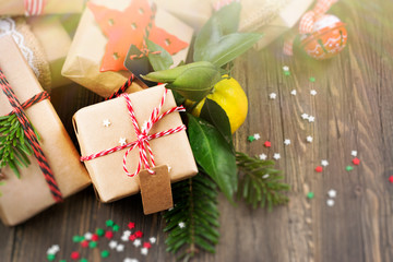 Many decorated Christmas presents on wooden background