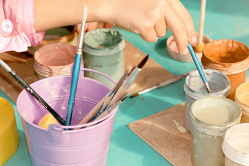 children learn to paint ceramics from the festival in Ukraine