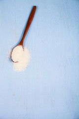 Wooden spoon with sugar